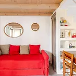 Tiny House On Water Surrounded By Greenery *