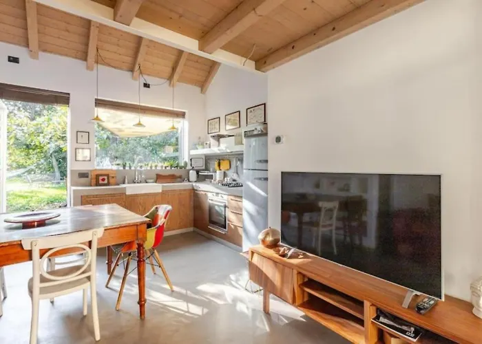 Tiny House On Water Surrounded By Greenery Apartment
